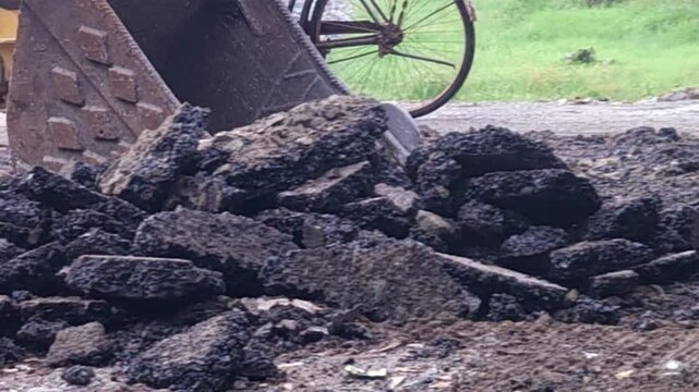 Busy construction site India. Heavy equipment and industrial machinery like bulldozer, compactor, pavers work on road and highway development, complete street maintenance for urban infrastructure