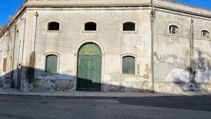 Large Green Wooden Door on Abandoned Building – Vintage Urban Scene