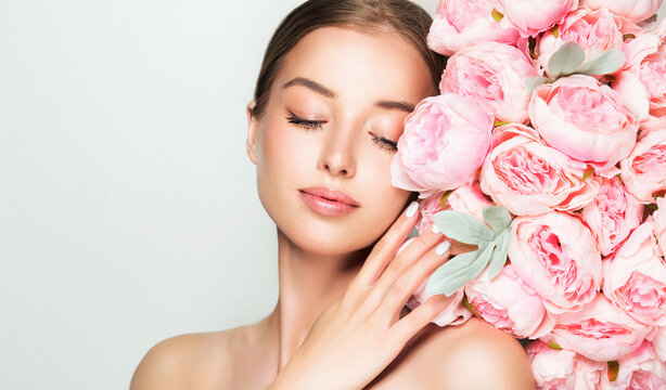 Fototapeta Beautiful young woman with clean fresh skin on face . Girl facial  treatment   . Cosmetology , beauty  and spa .