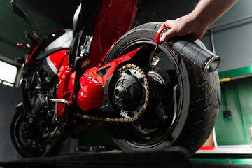 Motorcycle Chain Lubrication with Oil. Oiling motorcycle chain helps reduce wear, prevent rust, and...