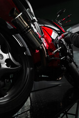 Precision oil fill operation on a red sportbike to ensure proper engine lubrication. Motorcycle Oil...