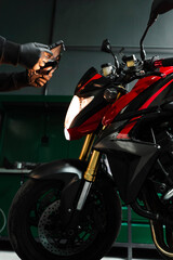 Mechanic performing system diagnostics via tablet. Motorcycle system diagnostic, scanning for...