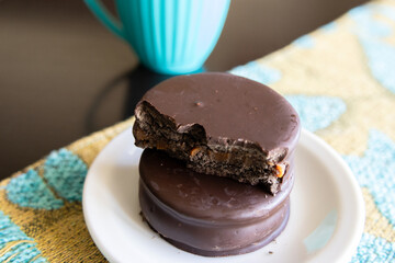 Dark chocolate alfajores in a small dish