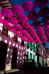 Colorful umbrellas and the beautiful streets of the Heritage Town of Jerico located in the Department of Antioquia in Colombia.