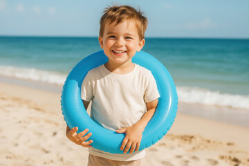Smiling child holding blue inflatable ring on sunny beach day