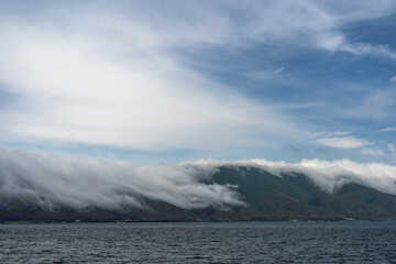 Beautiful sunset with clouds over the lake.