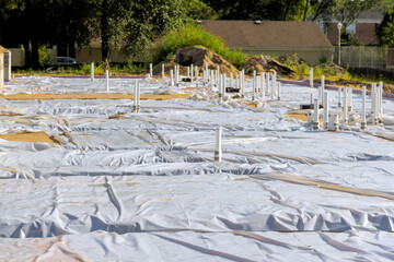 Construction site prepared with sheeting pipes for future building project in sunny weather