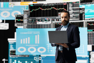 Economy expert reviewing financial data and KPI dashboards, ensuring business innovation and...