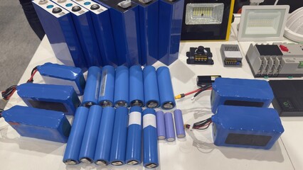 A set of lithium batteries and electronic modules on the demonstration table