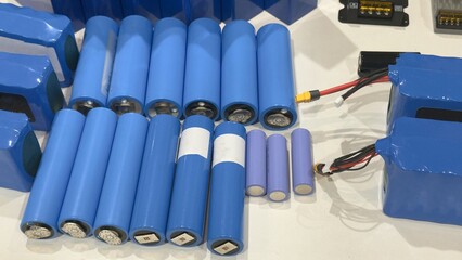 A set of lithium batteries and electronic modules on the demonstration table