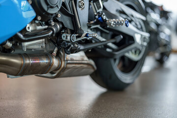 Close-up view of motorcycle exhaust system highlighting craftsmanship and engineering details...