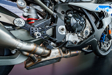 Close-up view of a high-performance motorcycle engine showcasing intricate components and modern...