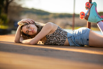 Enjoying a Sunny Afternoon in Roller Skates by the Serene Lakeside, a Moment of Youthful Joy and Relaxation