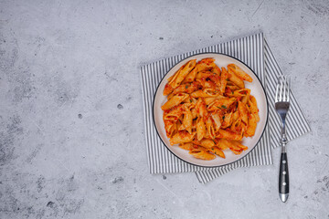 Pasta spaghetti Bolognese with red tomato souse on white plate on isolated white background.