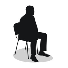 Silhouette of a viewer, a man sitting on a chair