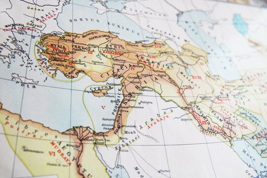 Close-up of an ancient historical map showing Asia Minor, Mesopotamia, and surrounding regions. Vintage detail of empires, cities, and territories with Latin inscriptions.