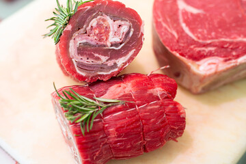 Meat rolls. Raw pork rolls stuffed with ham and cheese seasoned with rosemary. Pork loin. Semi-finished raw product