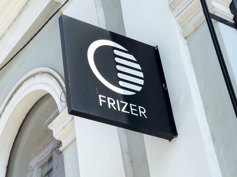 Ljubljana, Slovenia - June 03, 2025: Frizer salon sign displayed on a building exterior, showcasing modern branding and design elements in an urban setting with architectural details