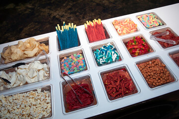 Ready-to-enjoy candy bar. Gummies, chips, peanuts, and popcorn.