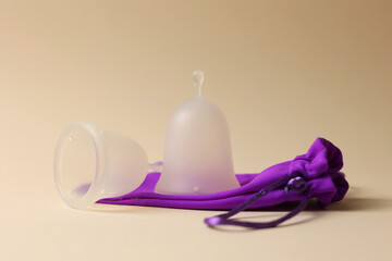 EcoFriendly Sustainable Menstrual Cups in a Pouch on a Bright Background