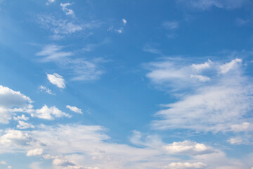 Expansive blue sky filled with fluffy white clouds, showcasing a serene atmosphere and natural beauty, perfect for backgrounds and creative projects with copy space