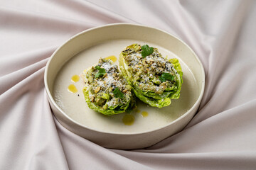 Crisp romaine leaves cradle a flavorful filling, topped with herbs and spices. The delicate presentation highlights the harmony of textures and colors, inviting enjoyment at any meal