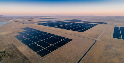 Aerial view of a vast solar panel farm in Santa Margarita, California, USA, harnessing renewable energy from the sun to power homes and businesses. © Zenstratus