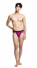 Fototapeta premium Asian male model showcases bold magenta and black cut-out briefs on a white background, blending contemporary men’s fashion, style, and confidence in this modern underwear photoshoot.
