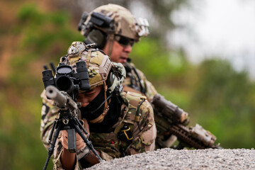 Special Forces Soldiers Armed and Ready During Tactical Training – Focused Military Men in...