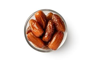 Glass bowl of dried date fruit isolated on white background. Top view
