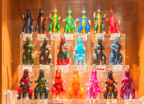 tokyo, shinjuku - apr 28 2025: Display of colorful collectibles plastic figurines of Godzilla and Gigan in a Toho cinema shop showcasing the iconic Japanese radioactive monsters from Tokusatsu movies.