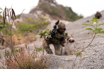 Special Forces Soldier Standing in Smoke During Tactical Operation – Full Combat Gear with Rifle...