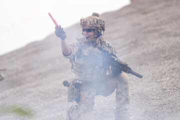Special Forces Soldier Standing in Smoke During Tactical Operation – Full Combat Gear with Rifle...