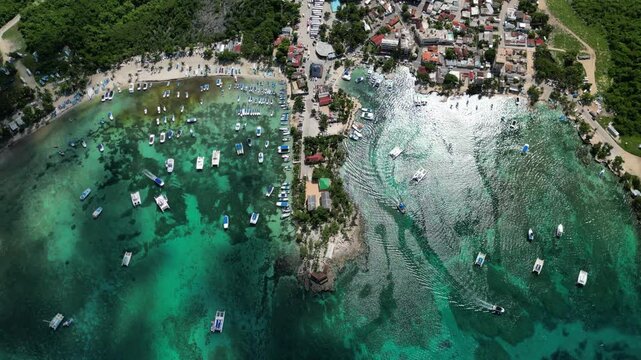 Aerial view of catamarans docked in the turquoise waters of Bayahibe, perfect for Caribbean travel content. Filmed on 14 November 2024