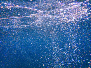 Air bubbles underwater rising to water surface, natural scene, bubbles under water, bubble...