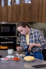 Woman Slicing Ingredients for Quiche in the kitchen.