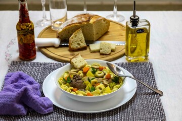 Delicious homemade tortellini and chicken soup with fresh vegetables
