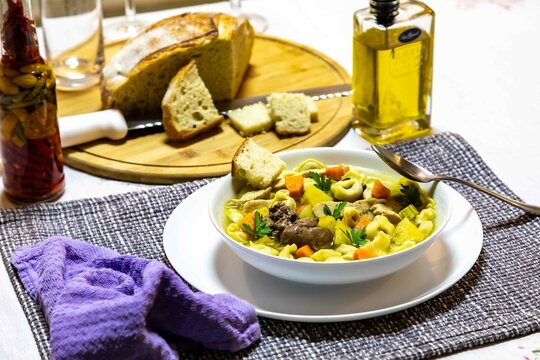 Delicious homemade tortellini and chicken soup with fresh vegetables