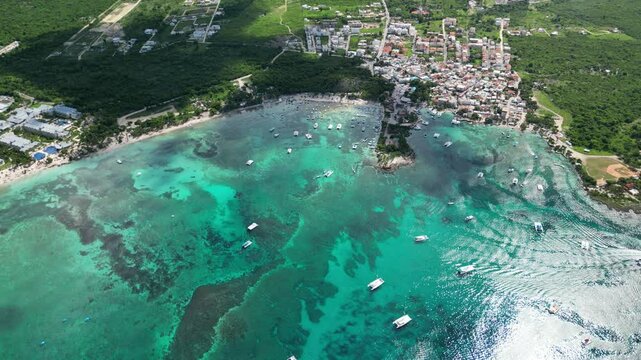Colorful aerial video of Bayahibe coastline with clear blue waters and water sports in action. Captured in the Dominican Republic on 14 of November 2024