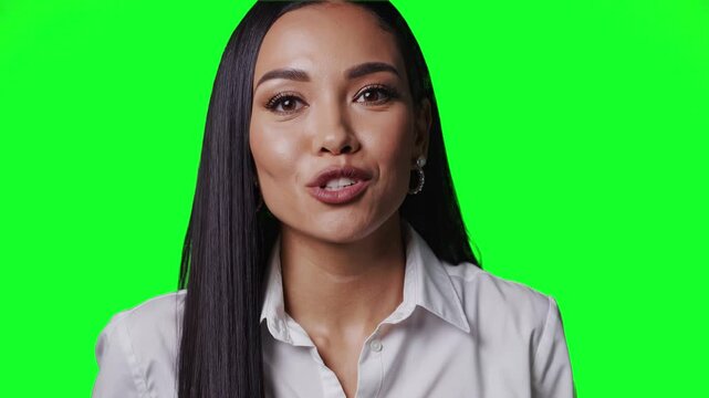 3D animated young woman with long straight black hair, wearing a white shirt, smiles and talks gently to the camera. Green screen background. Suitable for use in medical, educational, wellness, or cor