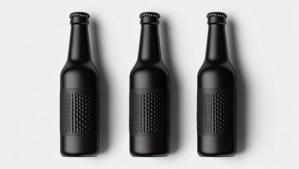 Three matte black beer bottles, arranged horizontally on a plain white surface. Each bottle features a textured, diamond-patterned label. High-angle, studio shot
