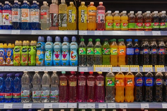 Soft drinks on the shelves of a shop