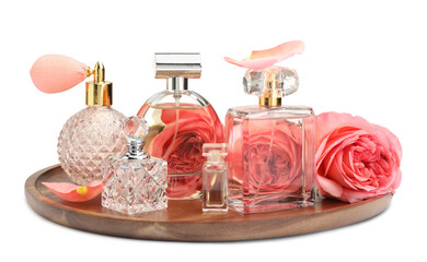Many different perfume bottles and roses isolated on white