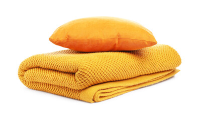Folded woolen blanket and pillow isolated on white