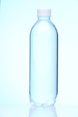 Plastic bottle with clean water on white background