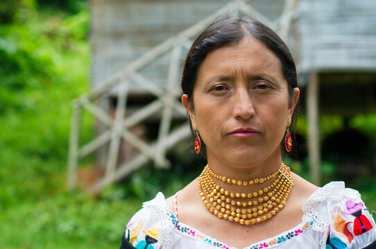 Indigenous colombian woman wearing traditional clothing and jewelry