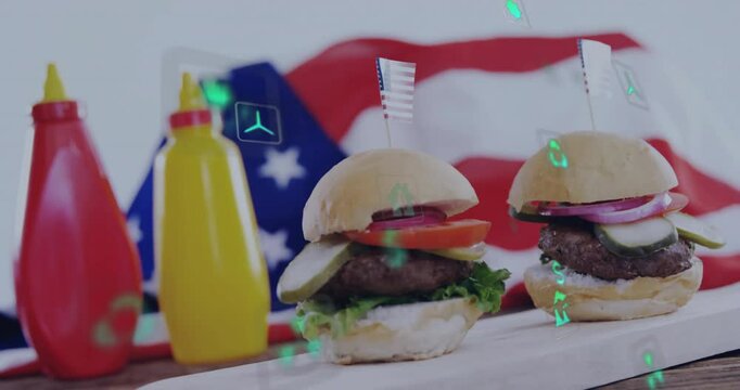 Focus shifting revealing two miniburgers with flags and eco icons drifting to show sustainability