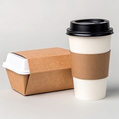 A takeout meal container wrapped in kraft paper sits next to a white coffee cup with a brown sleeve and black lid, all on a light background.