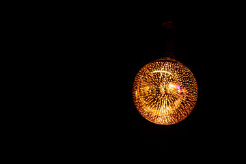 Multicolor vintage 3D fireworks decorative Edison light bulb in the dark. Decorative filament LED...