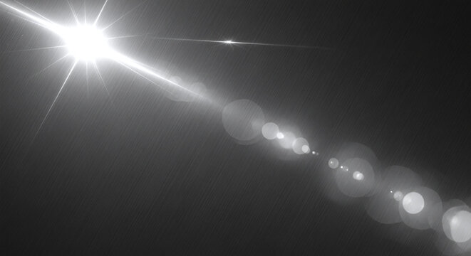 Bright starburst and lens flare streaks across dark background.